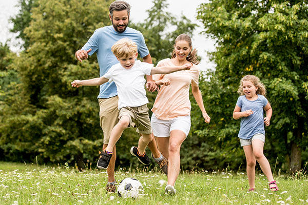Image of family playing with Soccer ball