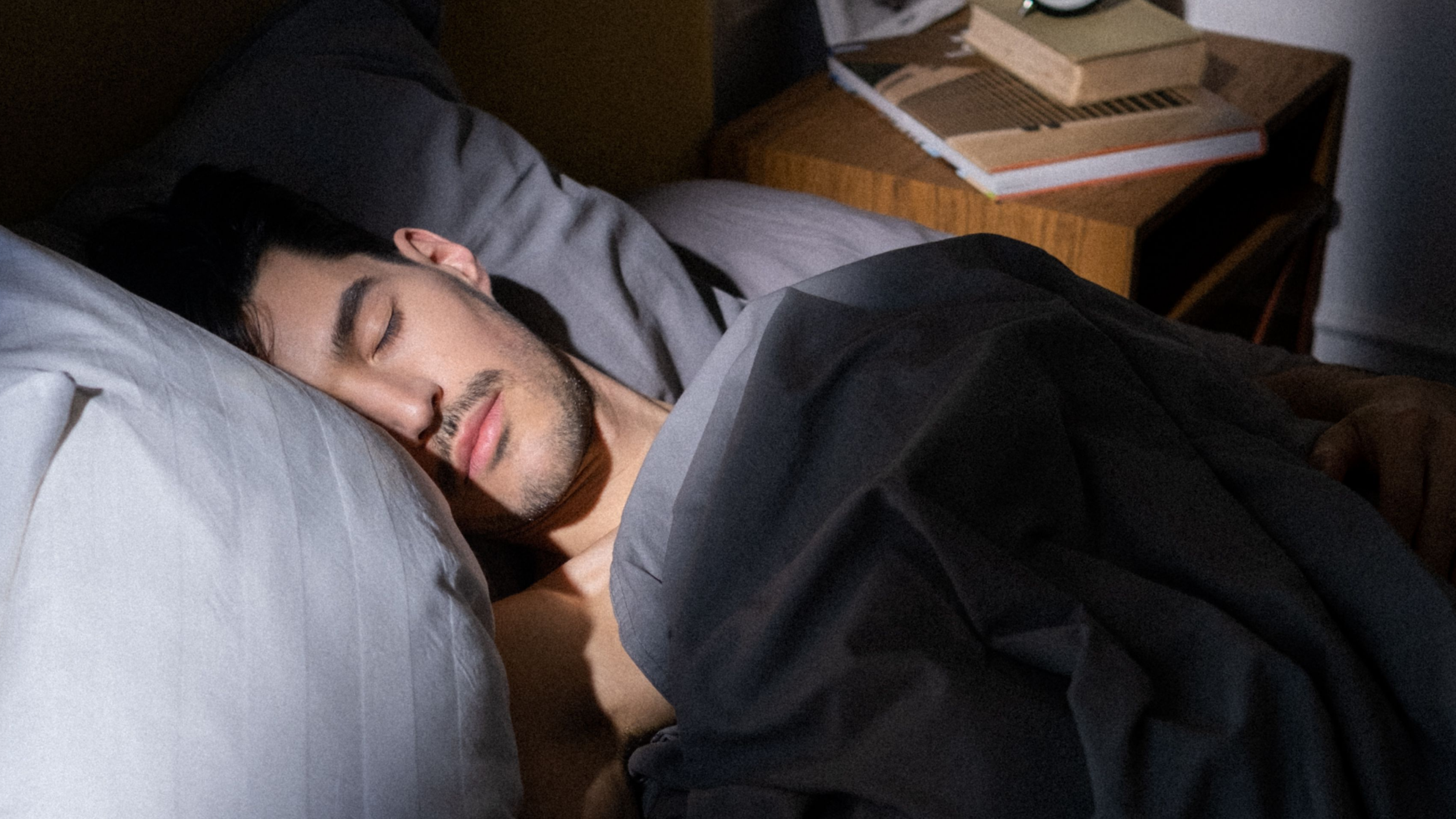 A man sleeping on the bed