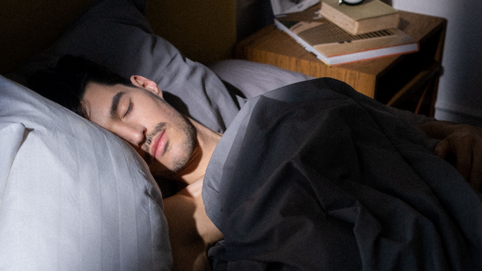 A man sleeping on the bed