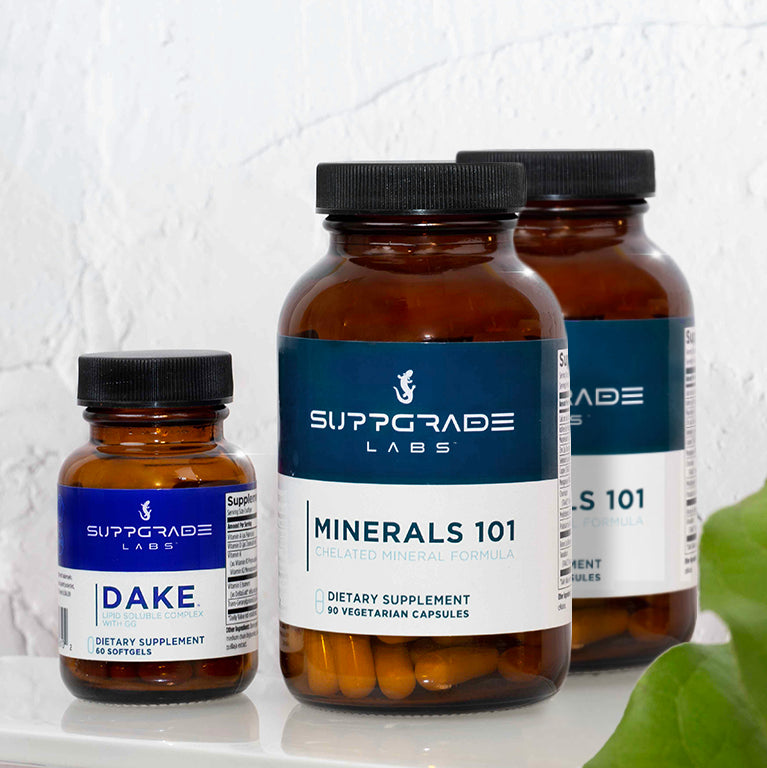 Bottles of Minerals 101 and DAKE™ shown