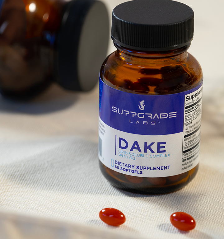 Bottle of DAKE™ shown